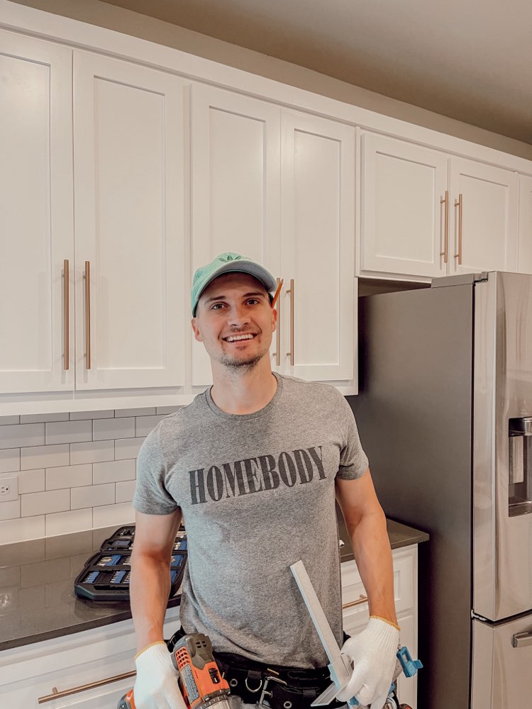 Smiling North Texas Cabinet Handles installer in the kitchen
